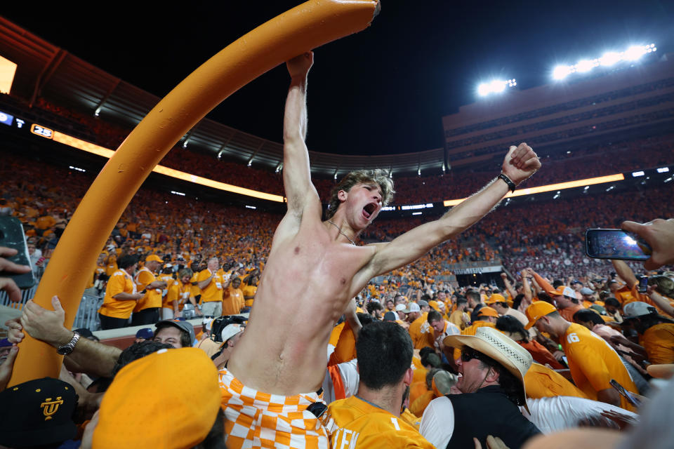 KNOXVILLE, TENNESSEE - OCTOBER 15: Tennessee Volunteers fans tear down the goal post while celebrating a win over the Alabama Crimson Tide at Neyland Stadium on October 15, 2022 in Knoxville, Tennessee. Tennessee won the game 52-49. (Photo by Donald Page/Getty Images)