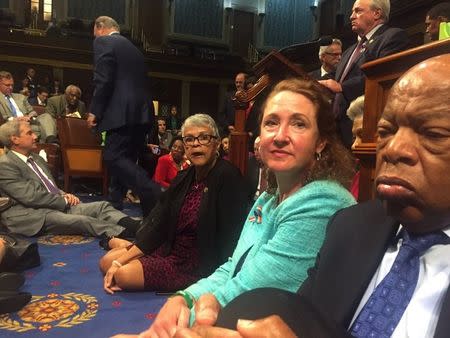 A photo shot and tweeted from the floor of the House by U.S. House Rep. David Cicilline shows Democratic members of the U.S. House of Representatives, including Rep. John Lewis (R) staging a sit-in on the House floor "to demand action on common sense gun legislation" on Capitol Hill in Washington, United States, June 22, 2016. REUTERS/ U.S. Rep. David Cicilline/Handout