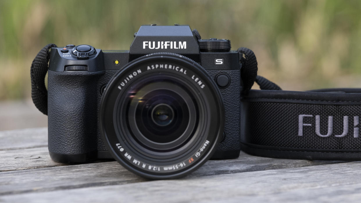  The Fujifilm X-H2S camera sitting on a wooden bench. 