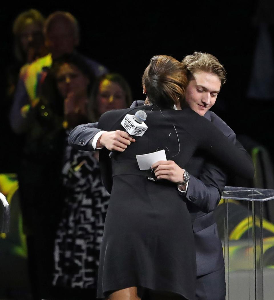 St. Ignatius senior Robbie Boyce, facing, hugs host Maria Taylor as he accepts the Courage Award during the 22nd Greater Cleveland Sports Awards at Rocket Mortgage FieldHouse on Wednesday.