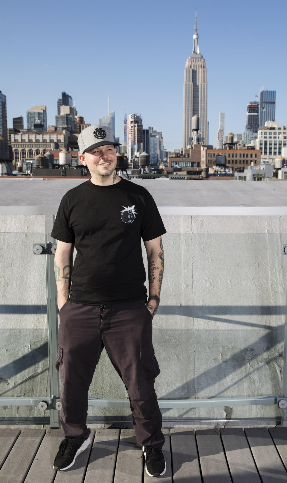 This July 12, 2019 photo shows Puerto Rican rapper, writer, and filmmaker René Pérez Joglar, known professionally as Residente, during a portrait session in New York. Residente studied intensely with professors at Yale University and New York University to create his second solo project. The untitled album will be released in November. (Photo by Brian Ach/Invision/AP)