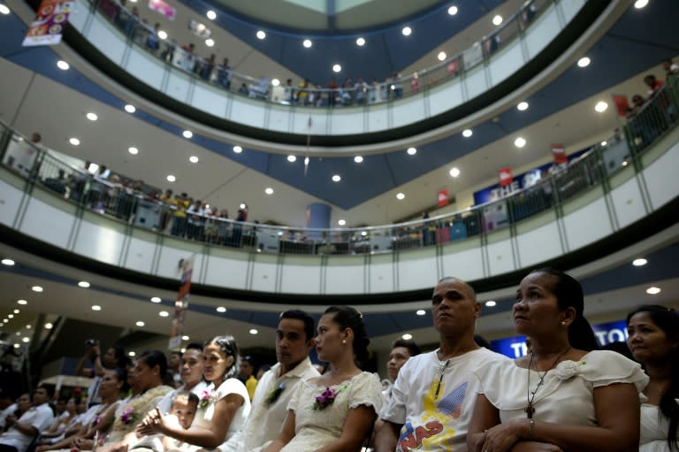 A mass wedding held inside a shopping center in Manila, on June 21, 2015