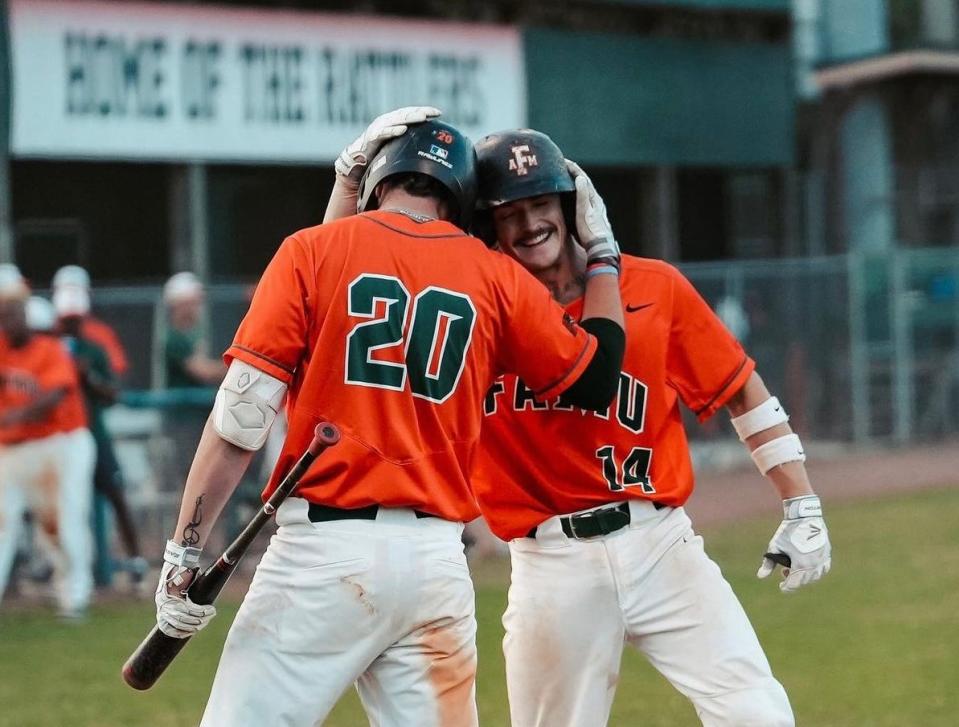 Florida A&M baseball third baseman Jared Weber (20) and catcher Ty Hanchey (14) embraces after scoring a run against North Florida at Moore-Kittles Field in Tallahassee, Florida, Tuesday, February 28, 2023