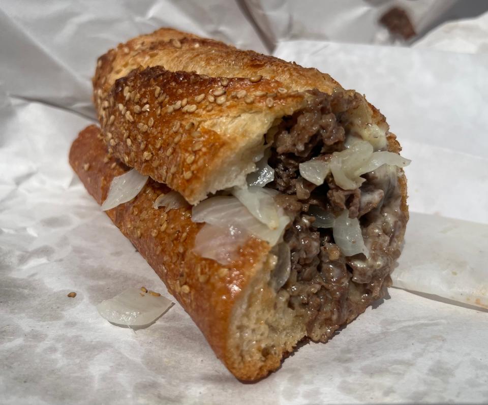 One half of a Cooper Sharp cheesesteak at Angelo's Pizzeria. Each cheesesteak comes with 10 ounces of ribeye on a house-baked roll made fresh multiple times a day, scooped out in the middle to make room for more meat.