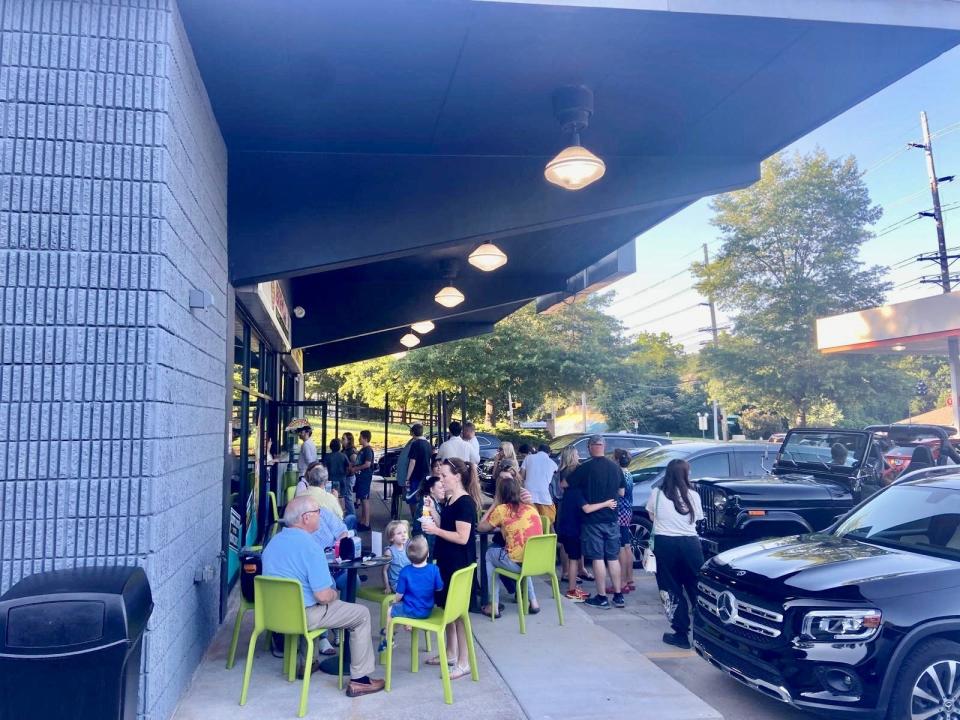 A crowd enjoys some Jeremiah’s Italian Ice sweet treats after the store at 1601 Ebenezer Road opened in July 2023. It is the first in the Florida-based chain to open in the Knoxville area, with more planned in the near future.