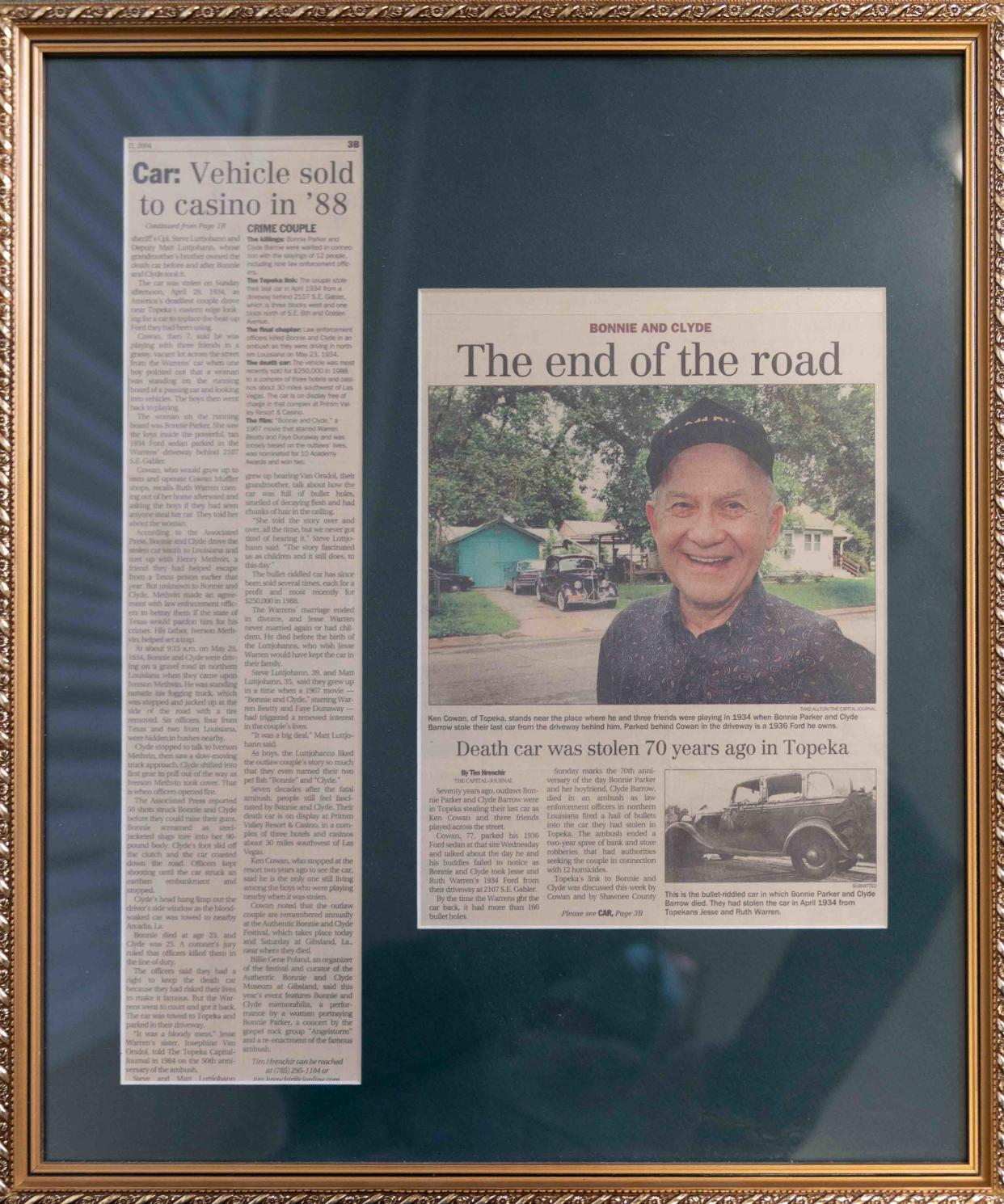 A framed article from The Capital-Journal shows a photo of Ken Cowan where he and his friends were playing at S.E. 6th and Gabler Street when Bonnie and Clyde stole their last vehicle.