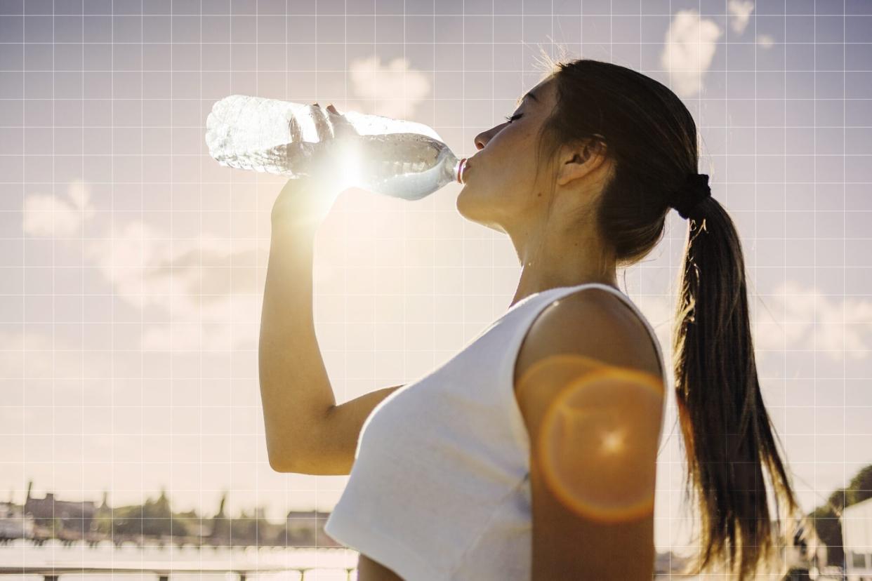 Woman drinking water on a designed background