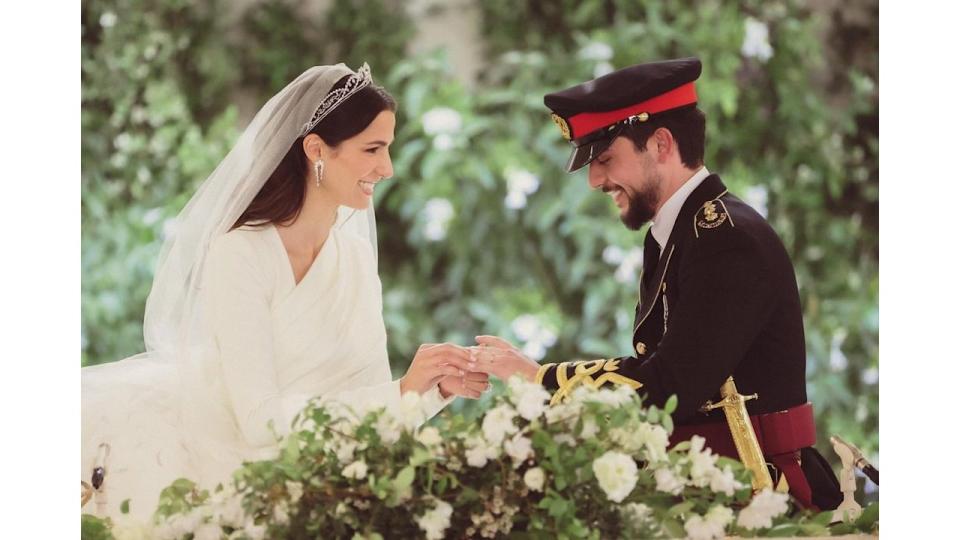 Crown Prince Al Hussein and his bride Rajwa Al Saif exchange rings during the wedding ceremony