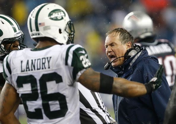 FOXBORO, MA - SEPTEMBER 12: Bill Belichick reacts after  D'Brickashaw Ferguson #60 of the New York Jets shoved Aqib Talib #31 of the New England Patriots, who intercepted a pass, in the 4th quarter at Gillette Stadium on September 12, 2013 in Foxboro, Massachusetts. (Photo by Jim Rogash/Getty Images)