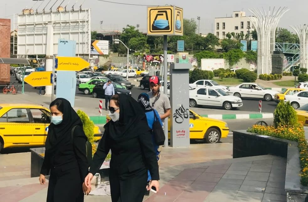 People wearing face masks as preventive measure against the coronavirus (COVID-19), walk at a street as daily life continues in the country amid COVID-19 pandemic in Tehran, Iran, on April 27, 2021. (Muhammet Kursun/Anadolu Agency via Getty Images)