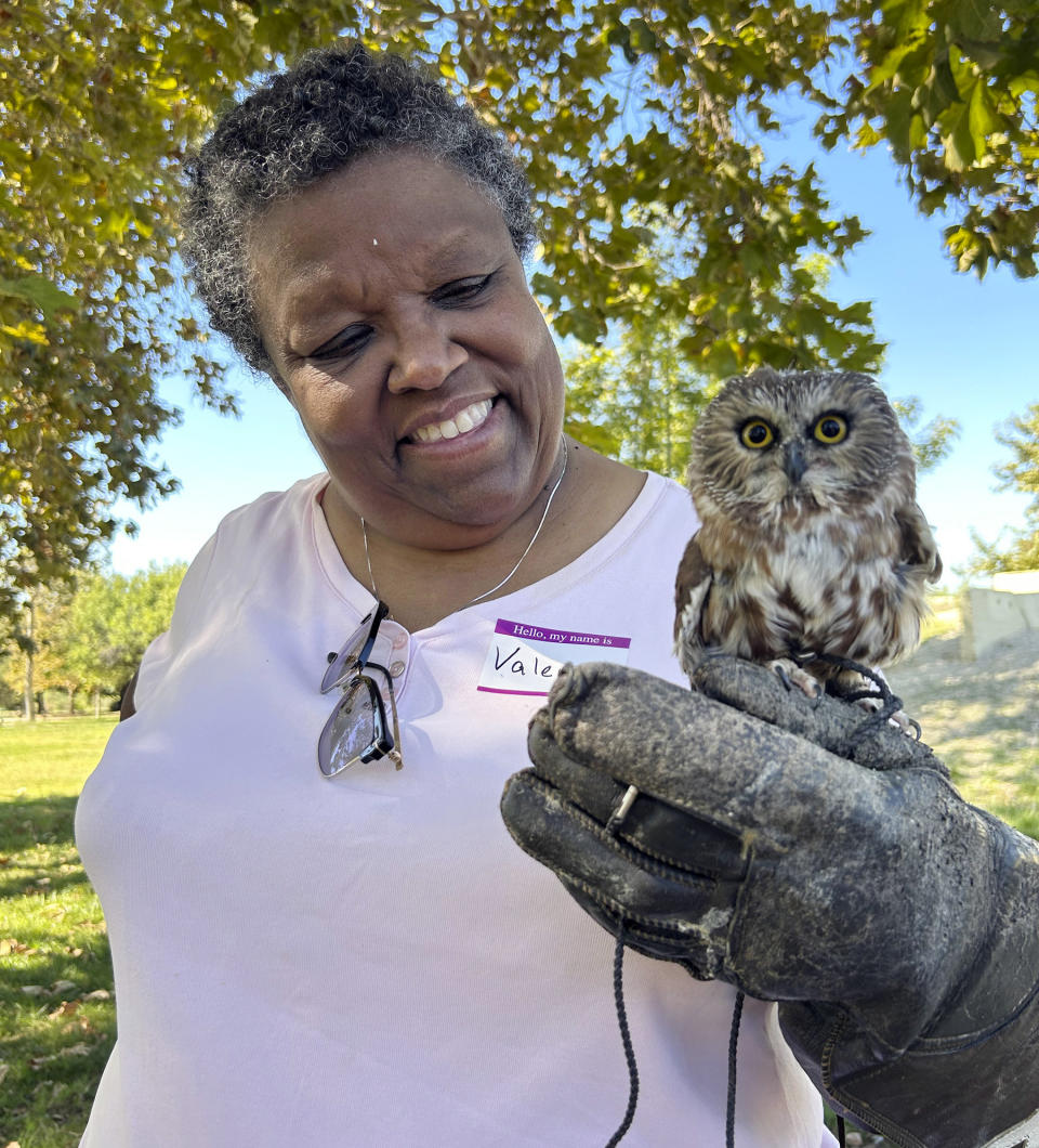 In this image provided by Valerie Richards, Valerie Richards holds a Northern Saw-Whet Owl named "Thor" during a Pasadena Audubon Society docent training program on Oct. 5, 2023, at Peck Road Water Conservation Park in Arcadia, Calif. (Courtesy Valerie Richards via AP)