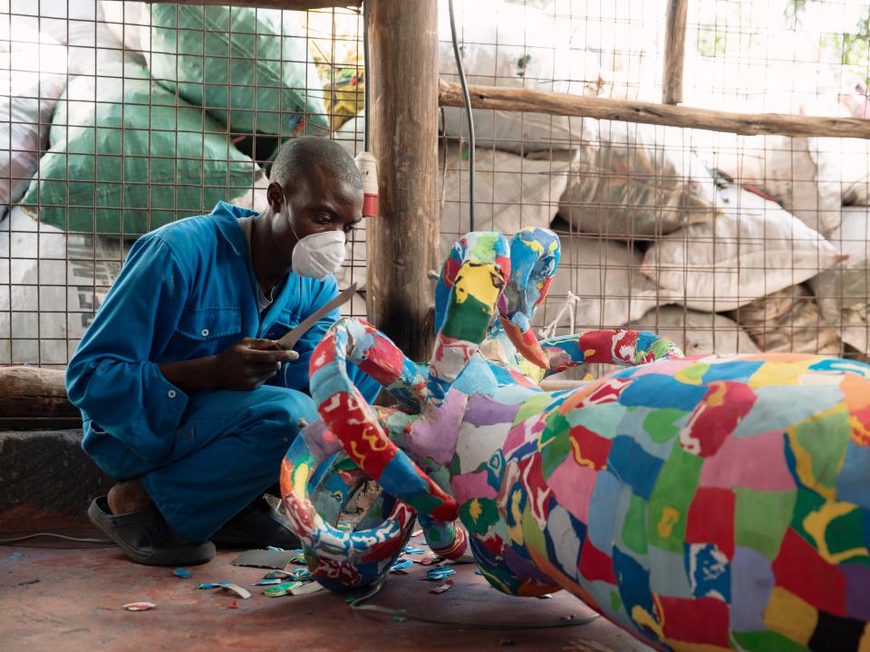 An artist works on a larger scale installation of a squid commissioned by a museumPaddy Dowling