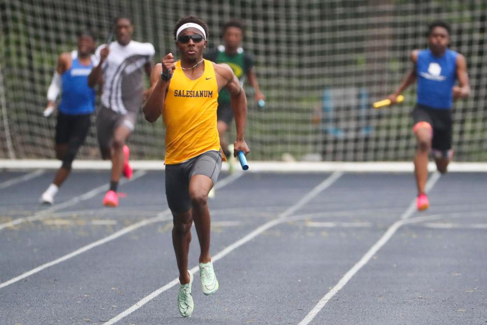 Salesianum's Bishop Lane has a comfortable lead as he anchors the boys 4x200 to a win during the New Castle County Track and Field Championships at Abessinio Stadium, Saturday, May 13, 2023.