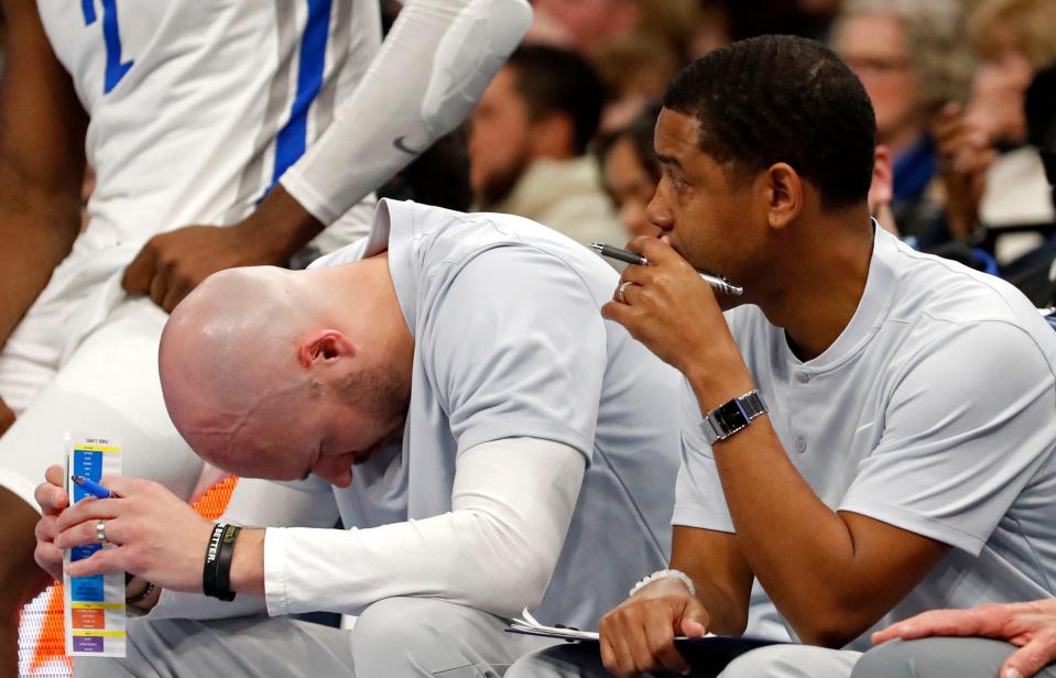 Memphis Tigers players and coaching staff react as it becomes clear their team will lose during the second half of a game Thursday, Jan. 20, 2022, at FedExForum. Southern Methodist defeated Memphis 70-62. 