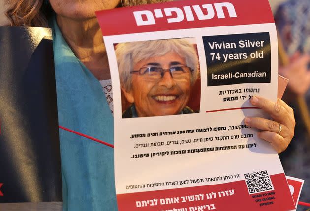 A demonstrator holds a poster bearing the image of Israeli-Canadian Vivian Silver during a protest for her release in Jerusalem on Oct. 29.