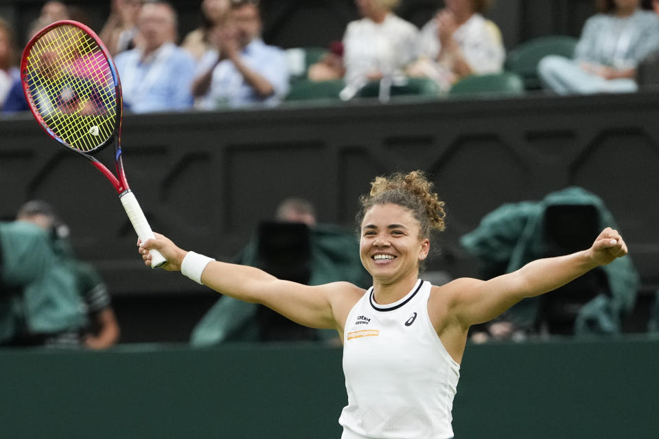 Jasmine Paolini of Italy celebrates after defeating Emma Navarro of the United States in their quarterfinal match at the Wimbledon tennis championships in London, Tuesday, July 9, 2024. (AP Photo/Alberto Pezzali)