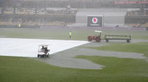 Rain stops play on day two of the fourth cricket test between India and Australia at the Gabba, Brisbane, Australia, Saturday, Jan. 16, 2021. (AP Photo/Tertius Pickard)