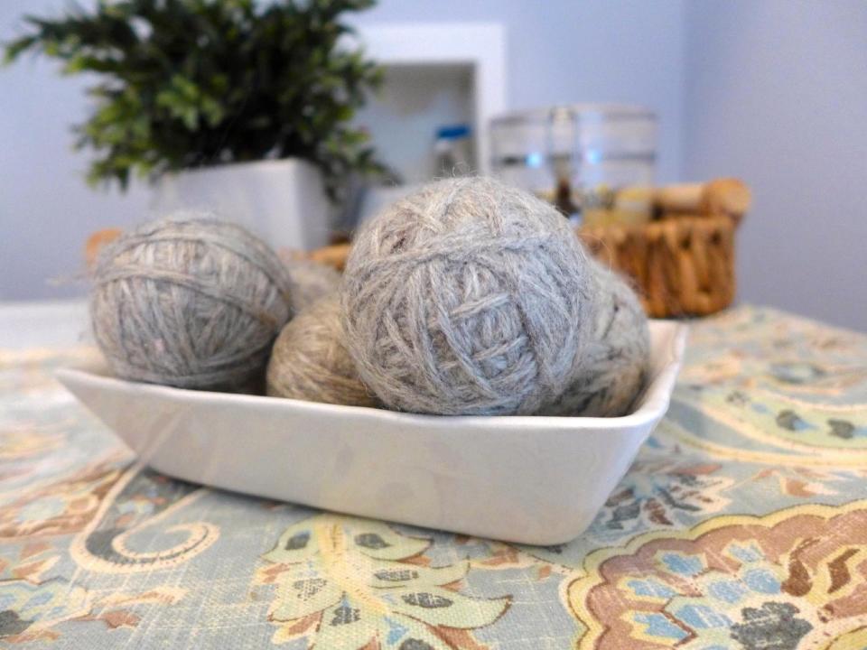 This photo provided by Sherri Griffin shows dryer balls that reduce drying time, static cling and wrinkles. Griffin, of Orlando, Fla., calls her homemade laundry detergent, fabric softener and dryer balls “a dream team.” “I often hear that people can't give up the fresh smell that they get from using dryer sheets, but what people don't understand is that smell comes from … chemicals,” says Griffin. (AP Photo/Sherri Griffin)