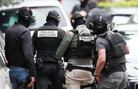 Investigators are seen during a police operation in Oullins, near Lyon, France May 27, 2019. REUTERS/Emmanuel Foudrot