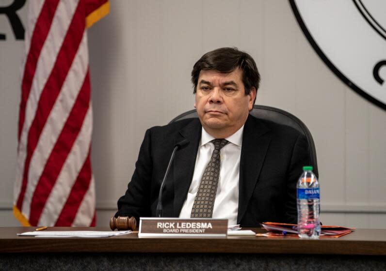 ORANGE, CA - JANUARY 19, 2023: Board President Rick Ledesma listens as concerned parents voice their opposition to the abrupt firing of Supt. Gunn Marie Hansen at the Orange Unified School District Board of Education meeting on January 19, 2023 in Orange, California. (Gina Ferazzi / Los Angeles Times)