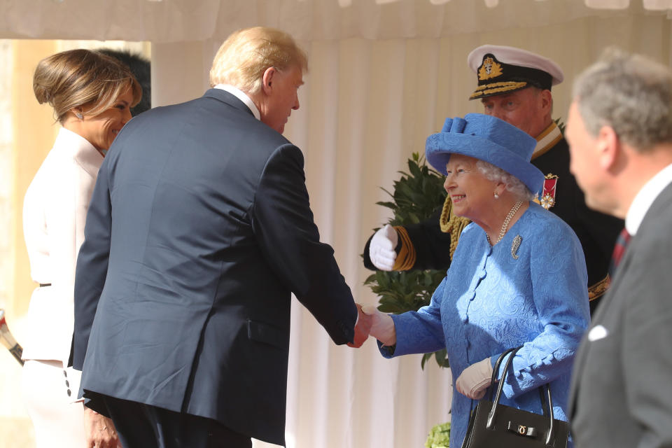 President Donald Trump and first lady Melania Trump are greeted by the queen. (Photo: PA Wire/PA Images)