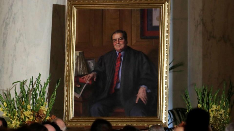 A portrait of the late Supreme Court Justice Antonin Scalia is displayed during a memorial