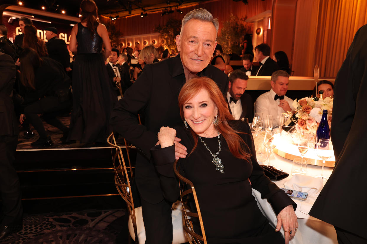 Bruce Springsteen and Patti Scialfa at a table at the 81st Golden Globe Awards.