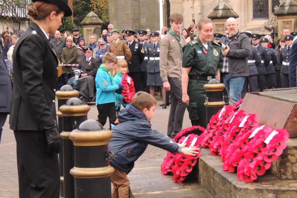Young and old included in the wreath laying. (Photo: Andy Hubbert)
