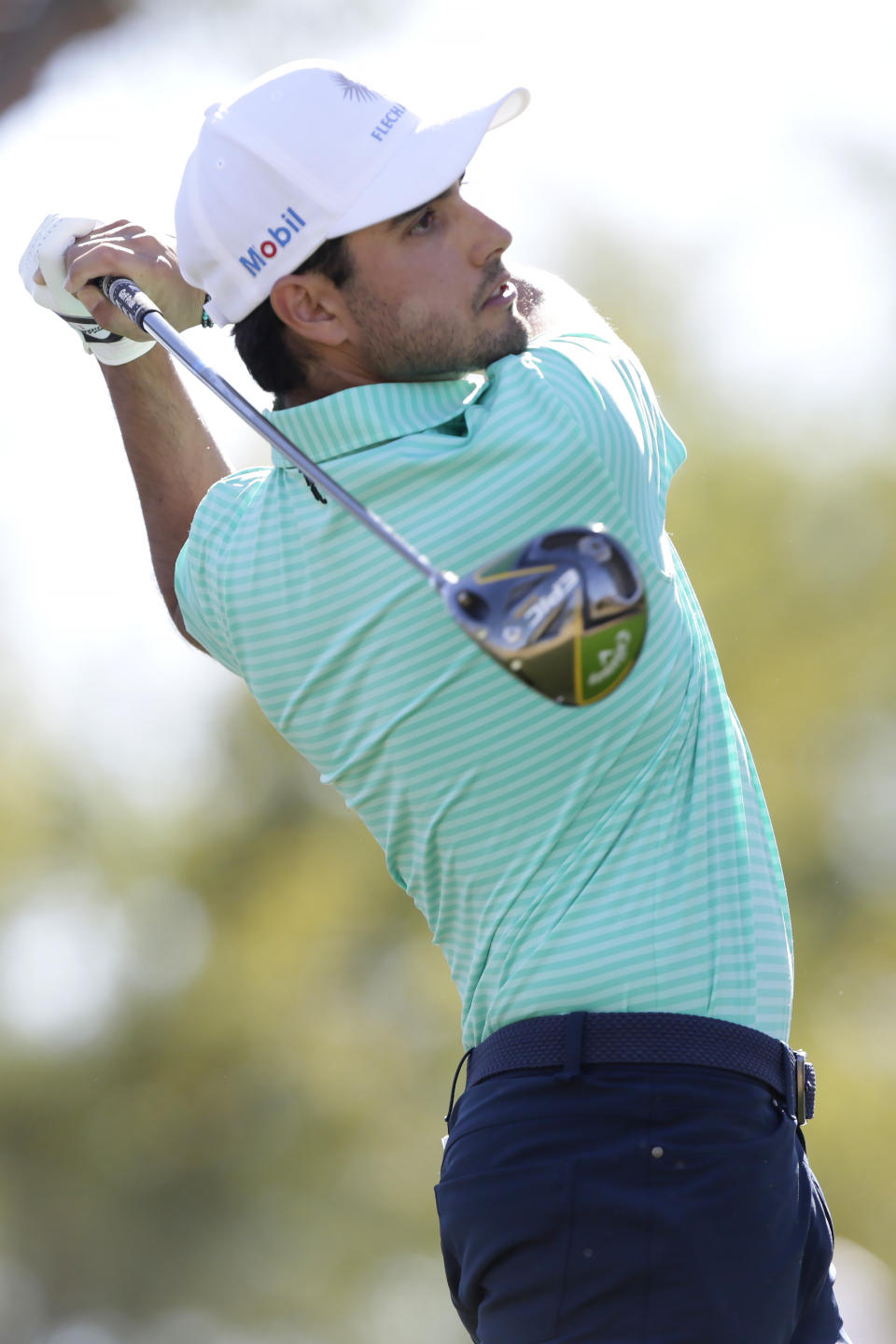 Abraham Ancer follows through on the third tee during the final round of The American Express golf tournament on the Stadium Course at PGA West in La Quinta, Calif., Sunday, Jan. 19, 2020. (AP Photo/Alex Gallardo)