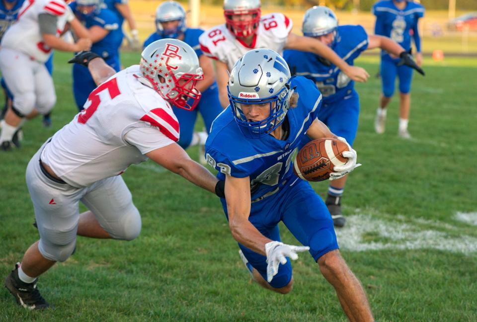 Wynford's Jaron Filliator slips past Buckeye Central's Damian Dean.