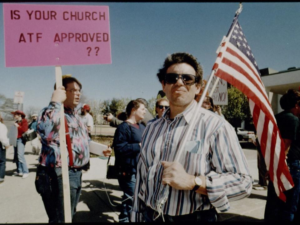 Protesters hold a sign that reads "Is your church ATF approved?" during a rally against the ATF during the siege in 1993.