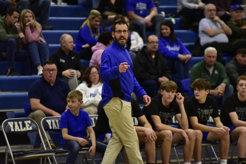 Croswell-Lexington coach Lance Campbell calls out a play during a game earlier this season. He earned his 100th career coaching victory in the Pioneers' 64-51 win over Imlay City on Friday.