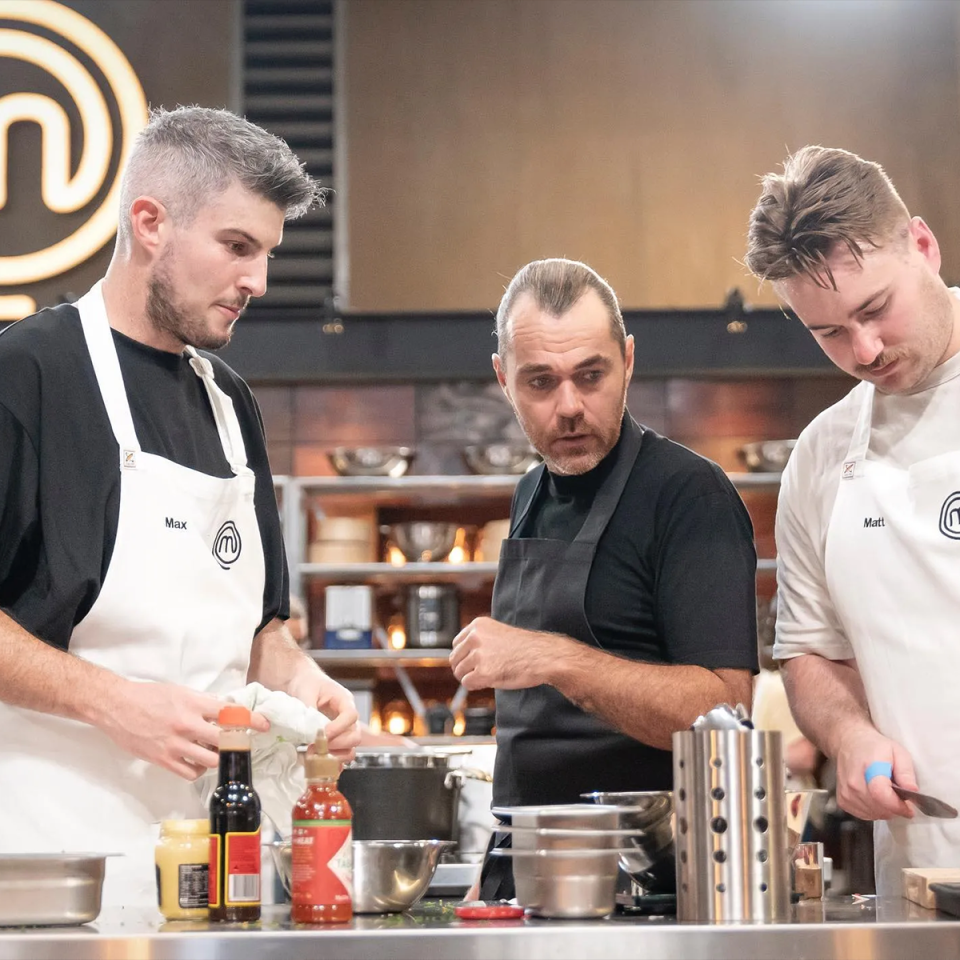 MasterChef's Max Krapivsky cooking in the kitchen.