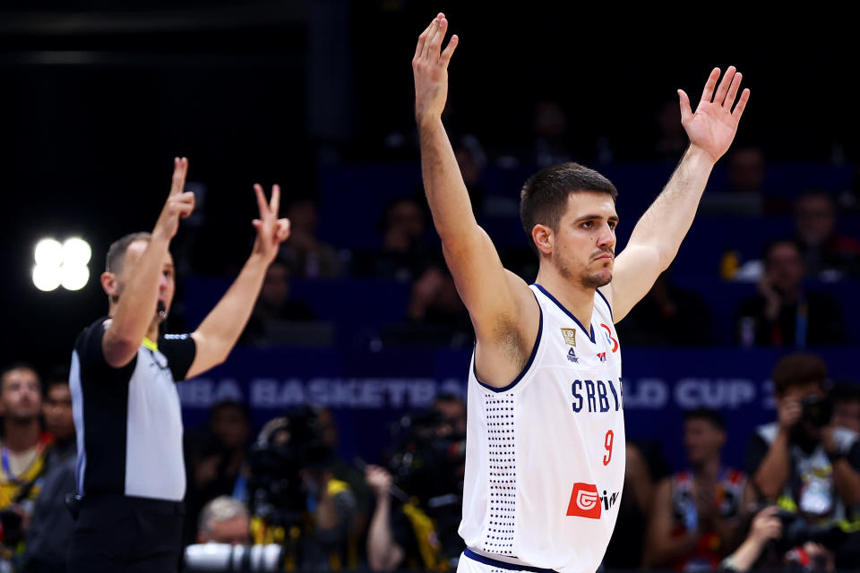 Serbia's Vanja Marinković celebrates a 3-pointer. (Yong Teck Lim/Getty Images)