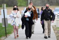 Jessica Runions’ mother, Jamie Ruions, center, arrives at the Cass County Justice Center Friday, April 16, 2021, for the sentencing of Kylr Yust. Yust was found guilty by a jury Thursday of killing Jessica Runions and Kara Kopetsky.