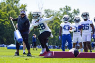 Indianapolis Colts running back Jonathan Taylor runs a drill during practice at the NFL team's football training camp in Westfield, Ind., Thursday, July 28, 2022. (AP Photo/Michael Conroy)