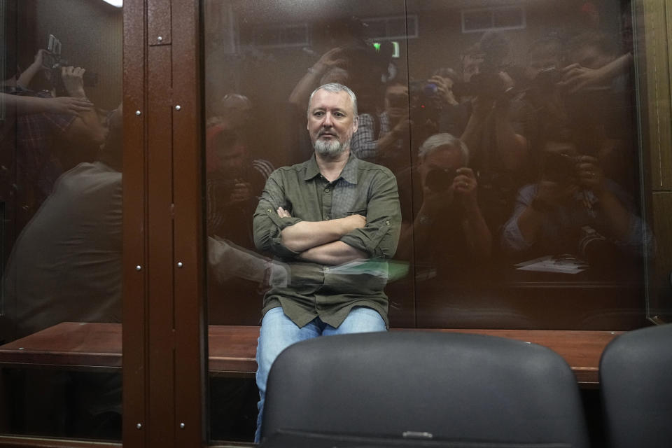 Igor Girkin also know as Igor Strelkov, the former military chief for Russia-backed separatists in eastern Ukraine, sits in a glass cage in a courtroom at the Moscow's Meshchansky District Court in Moscow, Russia, Friday, July 21, 2023. A prominent Russian hard-line nationalist who accused President Vladimir Putin of weakness and indecision in Ukraine was detained Friday on charges of extremism, a signal the Kremlin has toughened its approach with hawkish critics after last month's abortive rebellion by the Wagner mercenary company. (AP Photo/Alexander Zemlianichenko, Pool)