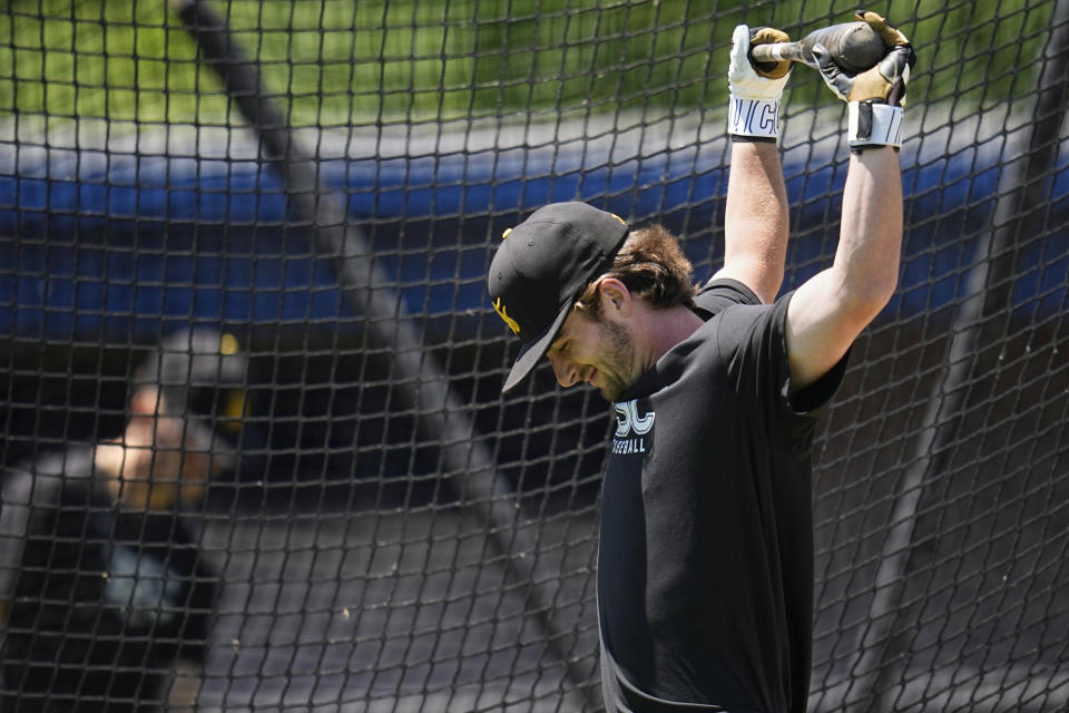 Birmingham-Southern infielder Andrew Dutton stretches during batting practice Thursday, May 30, 2024, in Kirtland, Ohio. On Friday, the Panthers will continue an unexpected, uplifting season that has captured hearts across the country by playing in the Division III World Series on the same day the liberal arts college founded on the eve of the Civil War shuts its doors. (AP Photo/Sue Ogrocki)