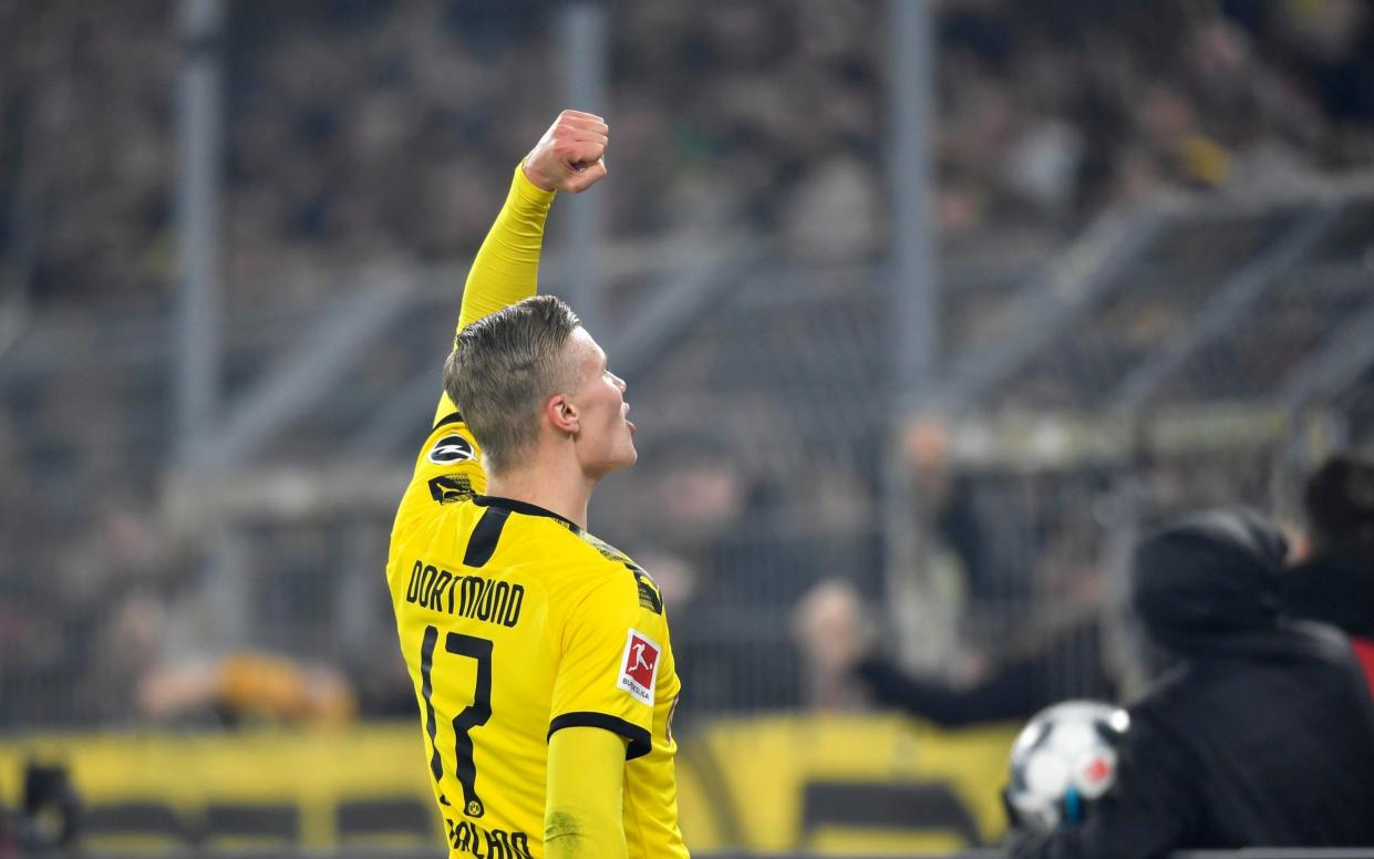 Dortmund's Erling Braut Haaland celebrates after scoring his side's third goal during the German Bundesliga soccer match between Borussia Dortmund and Eintracht Frankfurt in Dortmund, Germany, Friday, Feb. 14, 2020 - AP