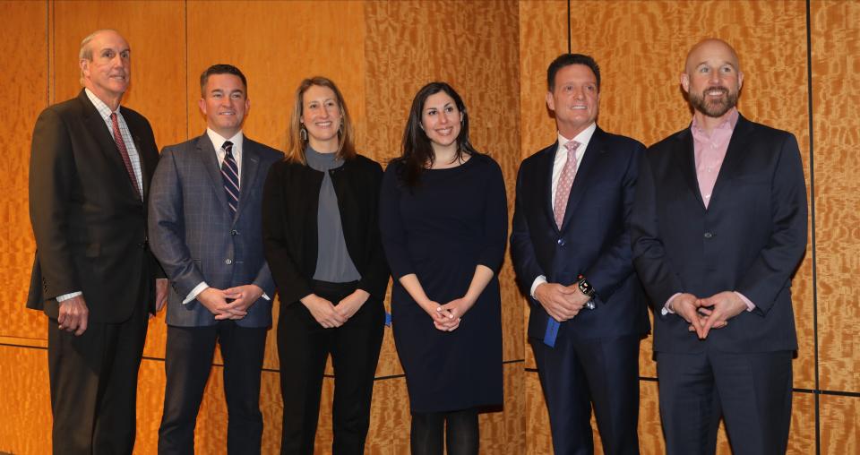 Stephanie Manfredi, fourth from left, the President of the Building Owners and Managers Association of Westchester (BOMA), poses for a photo with from left, Kevin Plunkett, Simone Development Companies; Kevin McCarthy, Cushman & Wakefield; Betsy Buckley from JLL, Mark Stagg, Stagg Group; and Ian Ceppos, JLL before a panel discussion discussing commercial real estate trends, Jan. 11, 2024 at the RECKSON offices in White Plains.
