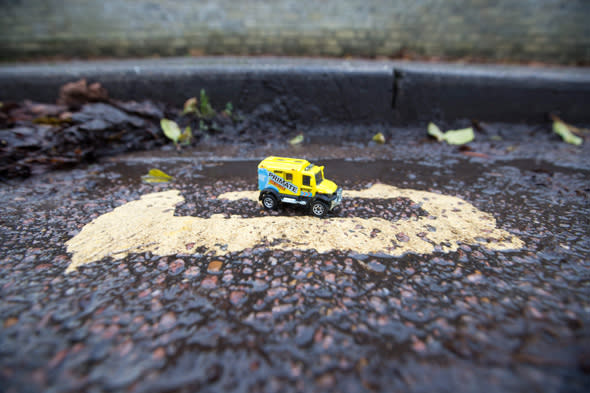 Mandatory Credit: Photo by Geoff Robinson Photography/REX (4313773b) A toy car parked on the 28cm long double yellow lines on Hamilton Road Council workers paint tiny double yellow lines measuring just 28cm, Cambridge, Britain - 18 Dec 2014 *Full story: http://www.rexfeatures.com/nanolink/prog Residents have been left bemused after council workers painted the SHORTEST double yellow lines in the UK measuring just 28cm. They were shocked when the set of yellow lines, which are shorter than a ruler, were painted between two parking zones in a street in Cambridge. Motorists will be fined either ï¿½50 or ï¿½70 if they manage to squeeze on the lines, which are the length of four toy cars. Locals have branded the new lines 