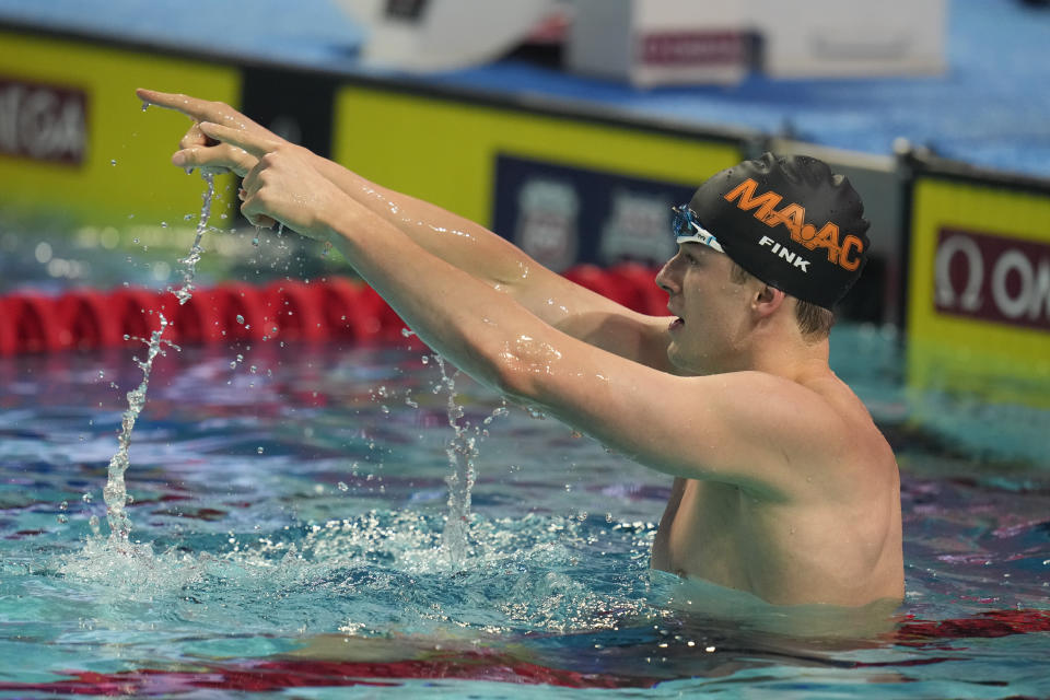 Nic Fink celebrates after winning the men's 50-meter breaststroke at the U.S. nationals swimming meet in Indianapolis, Thursday, June 29, 2023. (AP Photo/Michael Conroy)