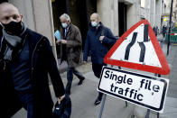 EU Chief Negotiator Michel Barnier, center, walks with his team to attend Brexit trade negotiations at a conference centre, in London, Tuesday, Dec. 2, 2020. Teams from Britain and the European Union are continuing face-to-face talks on a post-Brexit trade deal with little time remaining. (AP Photo/Matt Dunham)