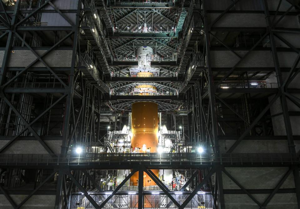 The fully stacked Space Launch System rocket for the Artemis I mission is seen in the Vehicle Assembly Building at Kennedy Space Center on Nov. 4, 2021. The rocket will fly NASA's first Artemis program test flight on an uncrewed mission around the moon no earlier than March 2022.