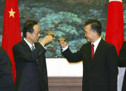 FILE - Japanese Prime Minister Yasuo Fukuda, left, toasts with Chinese Premier Wen Jiabao after a signing ceremony in Beijing's Great Hall of the People on Dec. 28, 2007. The Japan-China Exchange Festival in Tokyo, after a two-year hiatus due to the COVID-19 pandemic, was back on Sept. 24 and 25, 2022, ahead of this week’s 50th anniversary of the normalizing of relations between the two Asian neighbors and economic powerhouses. (AP Photo/Greg Baker, Pool, File)