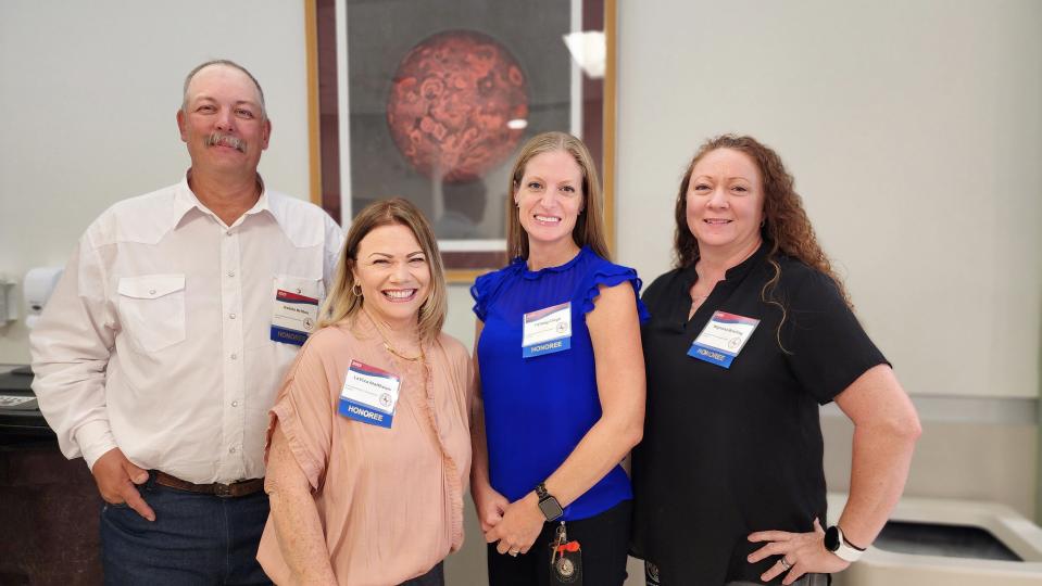 Honorees of the Texas Department of Motor Vehicles Amarillo Region await their awards Thursday at the Texans Caring for Texans award ceremony held at West Texas A&M University in Canyon.