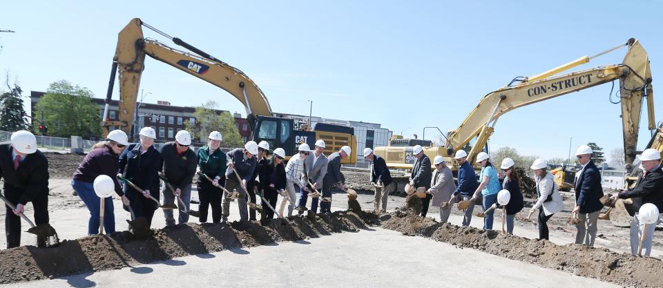 Ames mayor John Haila , City council members, donors, and other organizations members dig up soil during the ground breaking ceremony of the Fitch Family Indoor Aquatic Center at Lincoln Way on Wednesday, April 24, 2024, in Ames, Iowa.