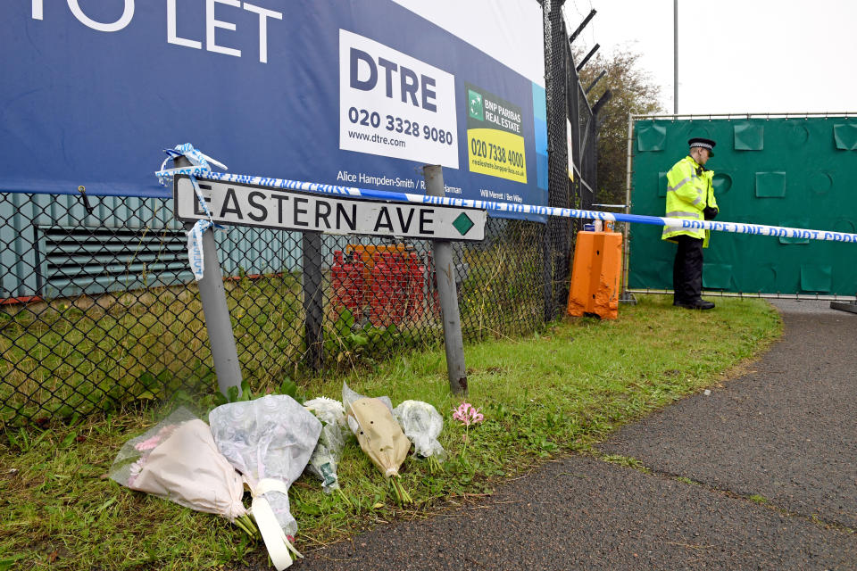 Floral tributes at the Waterglade Industrial Park in Grays, Essex, after 39 bodies were found inside a lorry on the industrial estate.