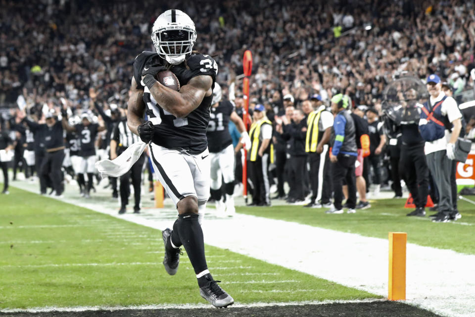 Las Vegas Raiders running back Brandon Bolden (34) scores a touchdown against against the Los Angeles Chargers during the first half of an NFL football game, Thursday, Dec. 14, 2023, in Las Vegas. (AP Photo/Steve Marcus)