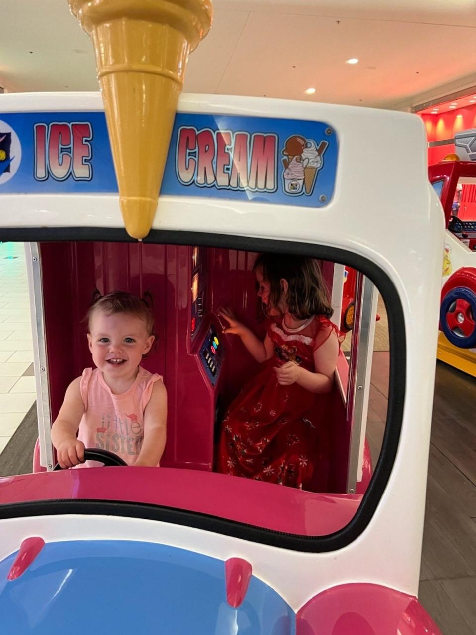 Sisters Avalee, 15 months, and Adeline Hintz, 3, have fun at a play café in Wisconsin.